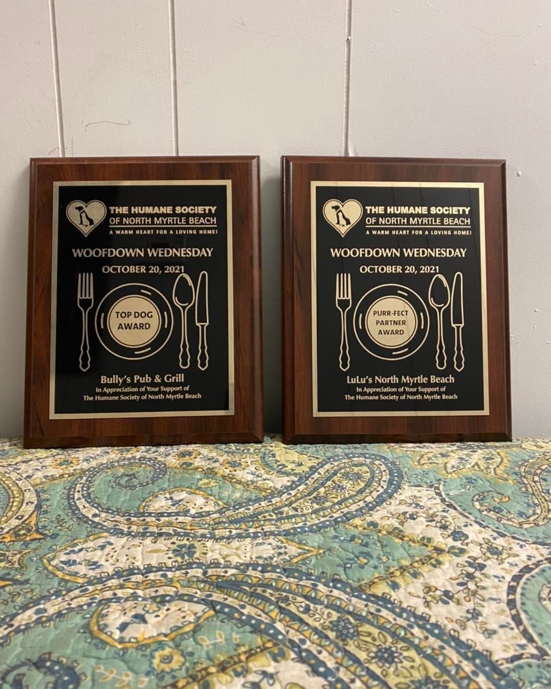 A huge thank you and lots of woofs for Coastal Engravers, Inc. of Myrtle Beach and North Myrtle Beach! They generously provided these plaques for our Top Dog Award and Purr-fect Partner Award for our Woofdown Wednesday event! ❤️